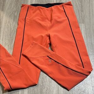Stylish Orange Leggings with Black Trim